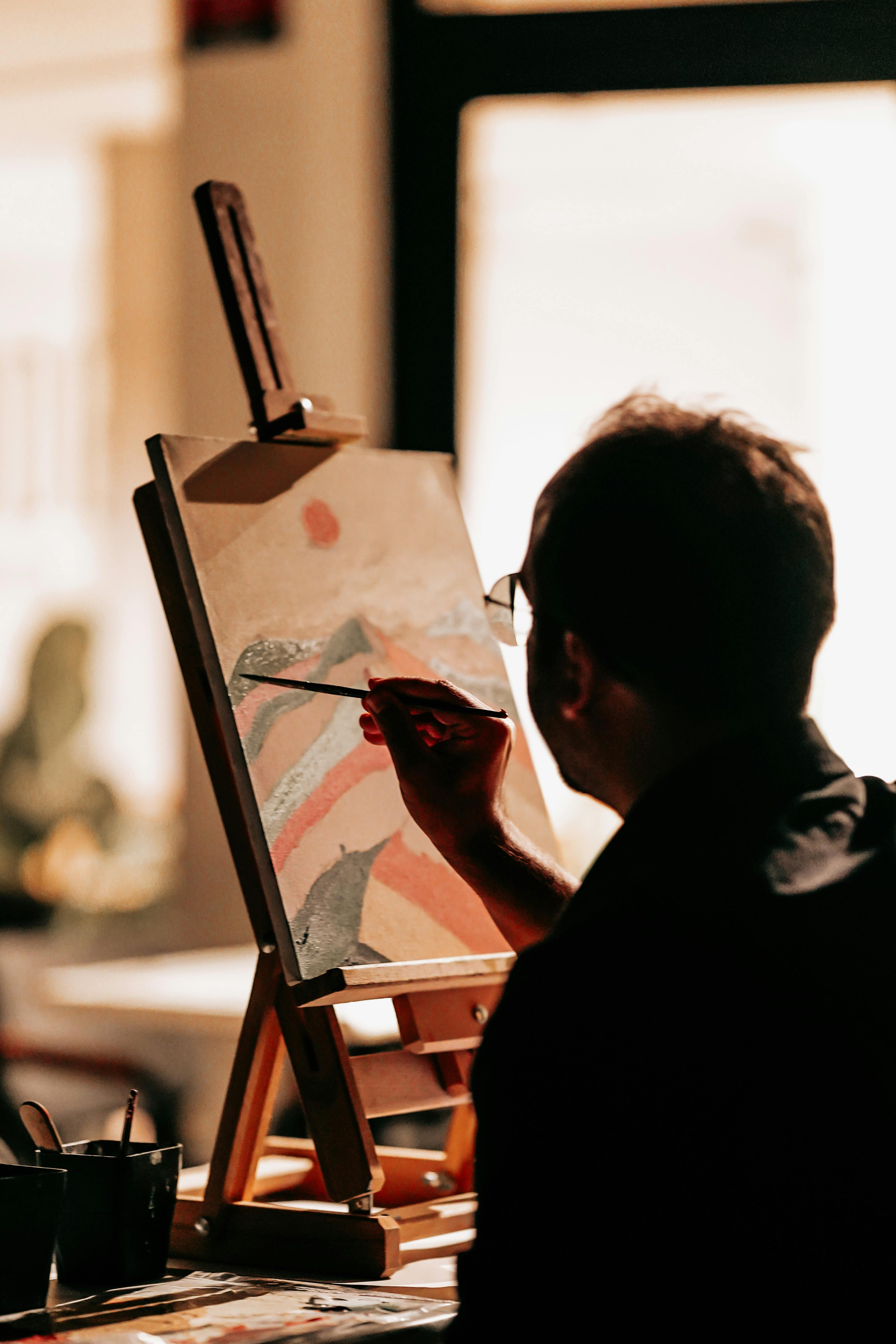 free-photo-of-man-painting-a-landscape.jpg